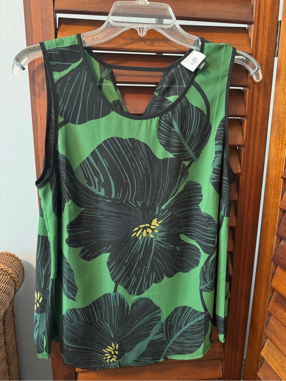 Cabi sleeveless blouse. Tie in front at neckline. Perfect for summer wear!